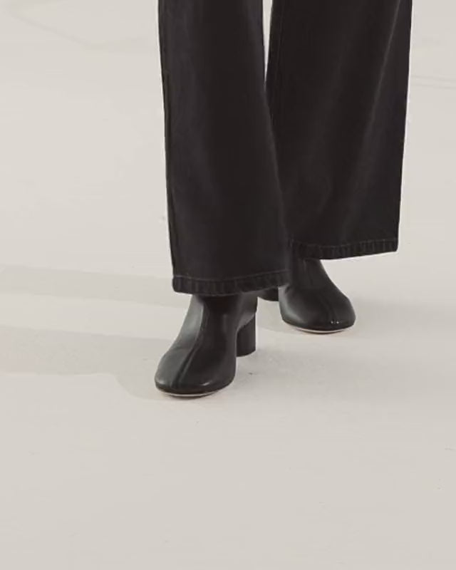 Harlie Boot in black nappa leather — on-model video showing the 5cm cylindrical heel and round toe in motion